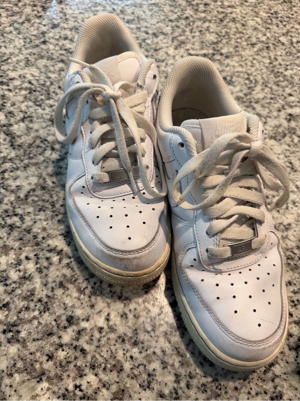 Size 8. Woman’s Nike Air Force 1 white sneakers